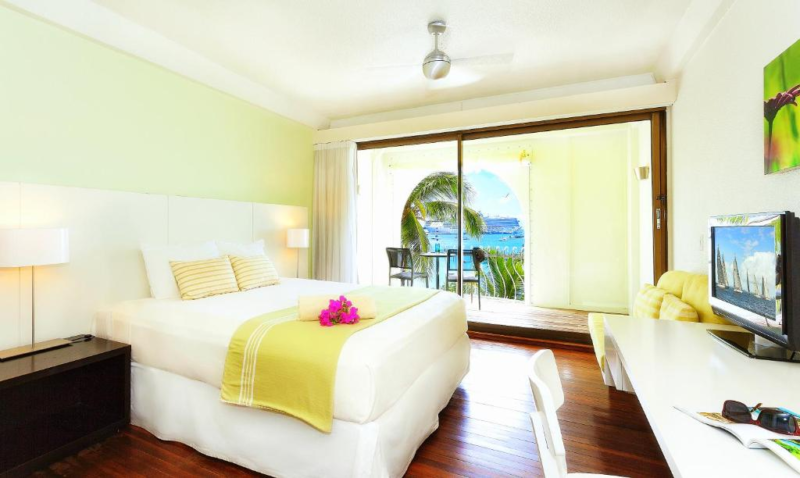 Bedroom And Outside View At Holland House Beach Hotel