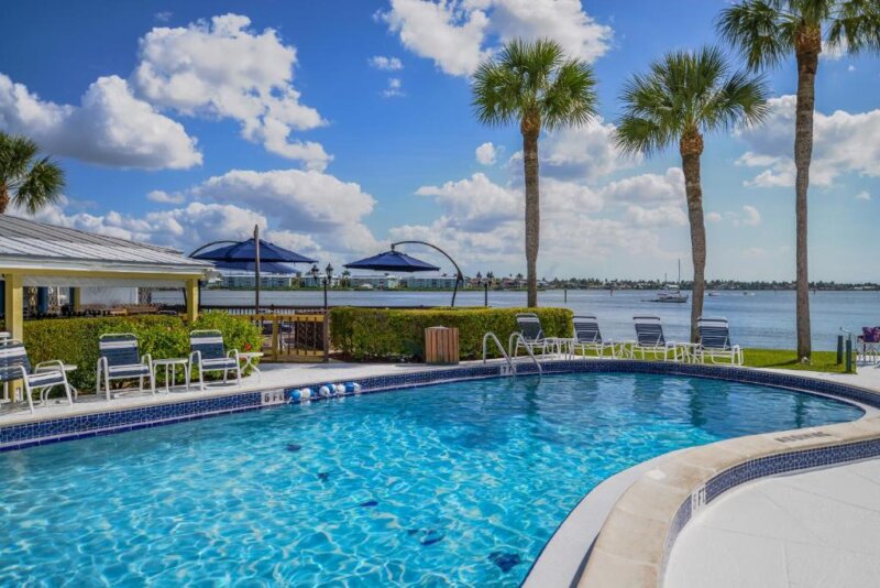 Pool Area With Bay View At The Charter Club Resort of Naples Bay